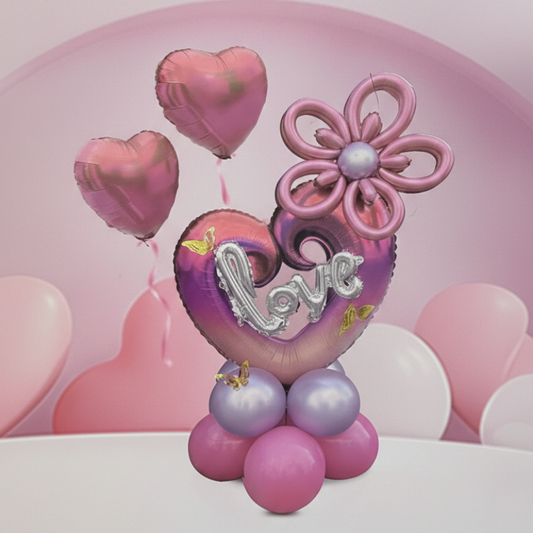 21-piece pink and purple heart balloon bouquet kit with silver Love script and flower topper