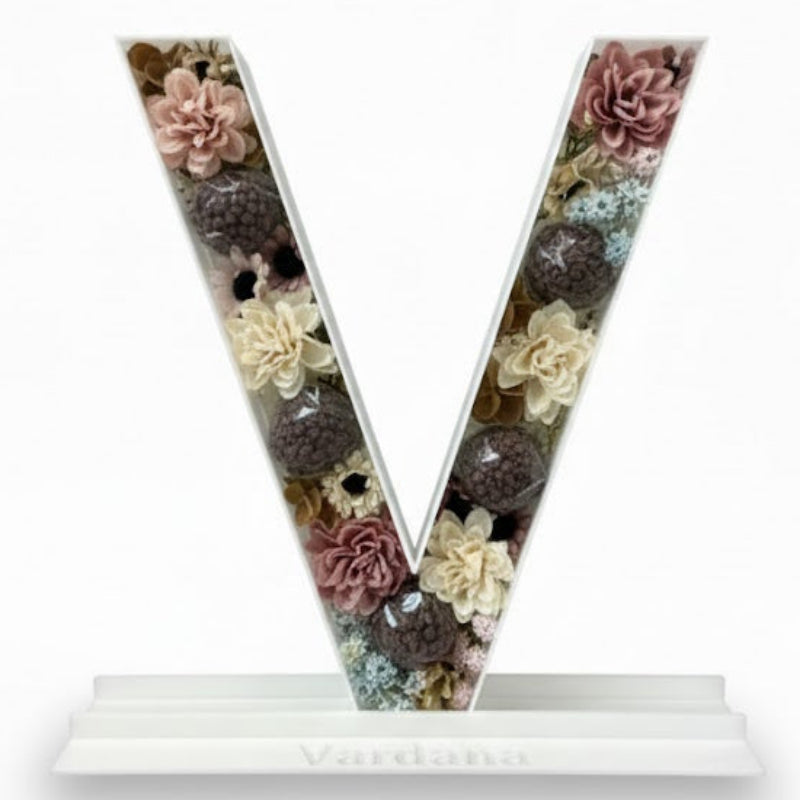 Letter 'V' with floral design 