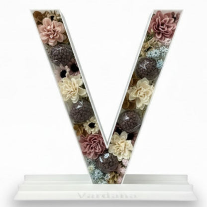 Letter 'V' with floral design 