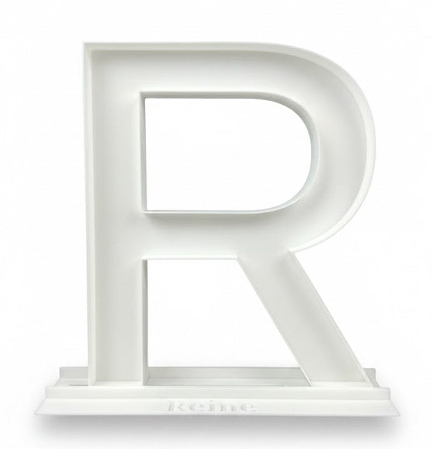 White letter 'R' on a white background