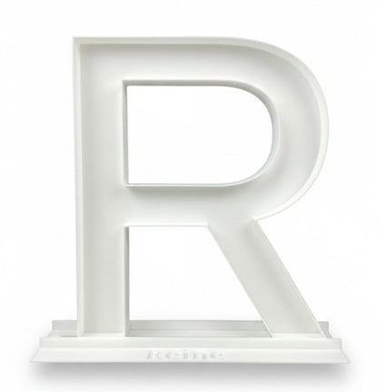 White letter 'R' on a white background